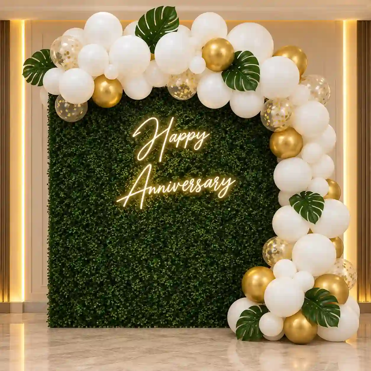 White and Gold Anniversary Balloon Decoration with Green Backdrop