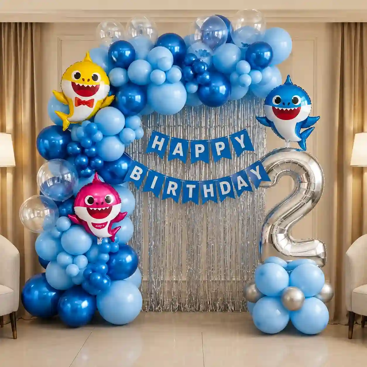 Blue Baby Shark birthday decoration with balloon garland and Happy Birthday banner