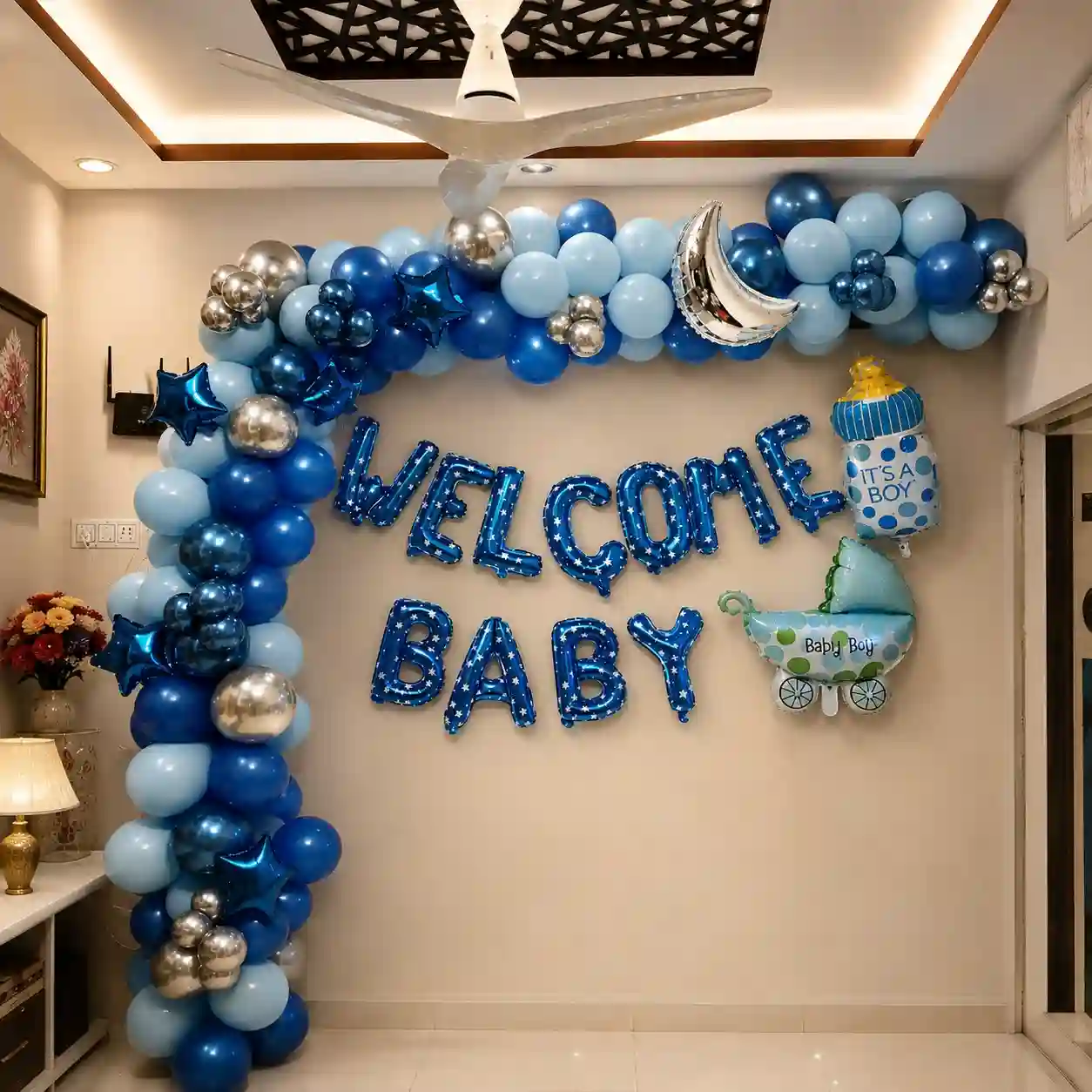 Blue theme welcome baby balloon decoration with blue balloon arch, silver moon, star balloons and Welcome Baby foil letters