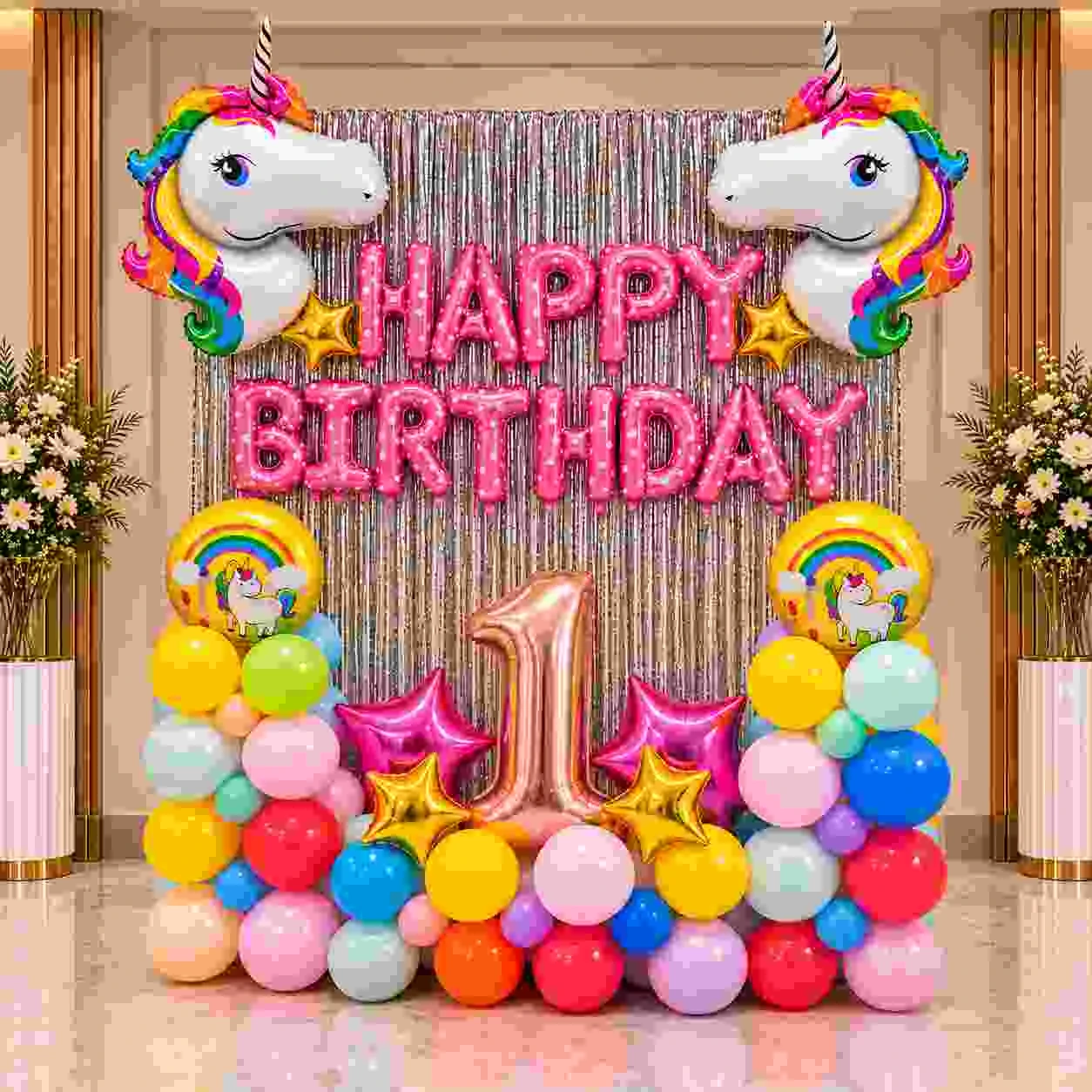 Unicorn first birthday decoration with pink HAPPY BIRTHDAY balloons, colorful balloon stands, unicorn foil balloons and rose-gold number 1